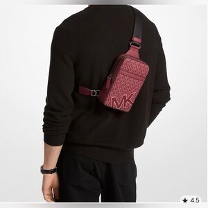 NWT Michael Kors Cooper Medium Signature Logo Sling Pack in the color Cherry